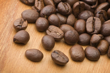 Coffee beans close up on the wood table