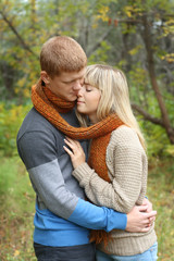 Fototapeta premium Romantic young couple embrace in Autumn Park