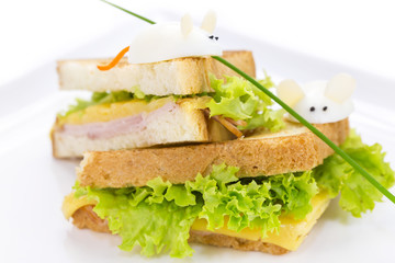 sandwich with ham and cheese, decorated eggs