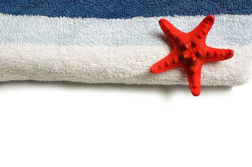 Blue towel with red starfish isolated on white background