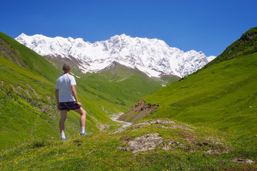Naklejka na ściany i meble Tourist in the mountains of the Caucasus