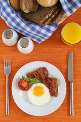 Fried egg and bacon for breakfast