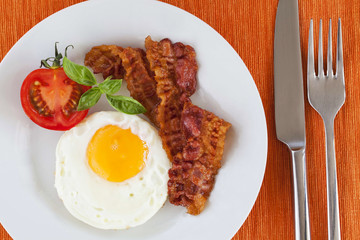 Fried egg and bacon for breakfast