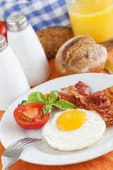 Fried egg and bacon for breakfast