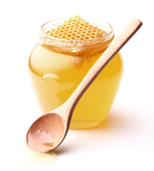 Fresh honey with wooden spoon
