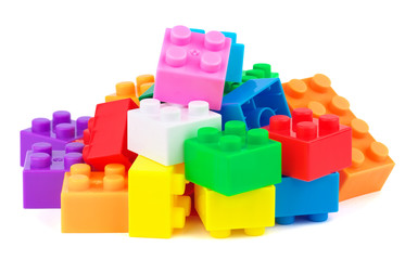 Toy plastic colorful blocks on white background