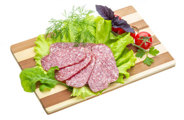 Sausages with salad and basil