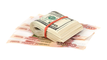 Folded dollar bills laying over rouble background