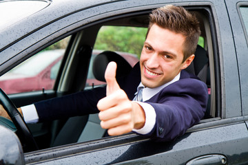 Happy man in his new car