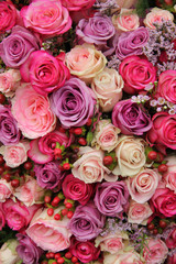 purple and pink roses wedding arrangement