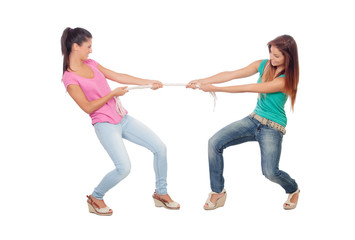 Two beautiful women pulling a rope