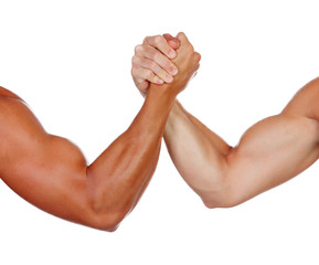 Two powerful men arm wrestling