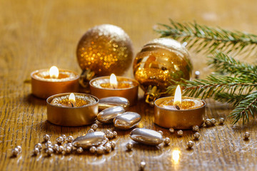Beautiful golden candles. Christmas eve mood. Selective focus.