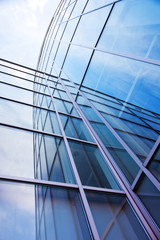 Fototapeta na wymiar facade of modern glass blue office and sky