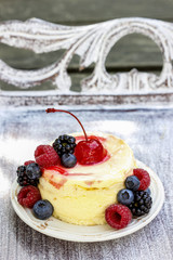 Round cake with fresh fruits. Garden party.