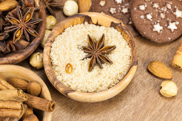 Fototapeta na wymiar Ingredients for baking Christmas cookies in olive wood bowl