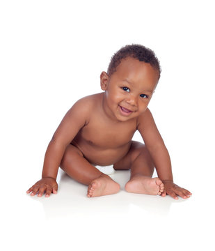 Adorable African Baby In Diaper Sitting On The Floor