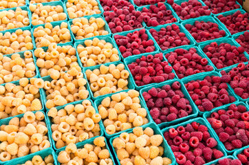 red and yellow raspberries in boxes