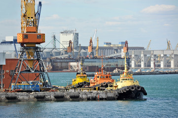 Tugboat and freight train under port crane, Odessa, Ukraine