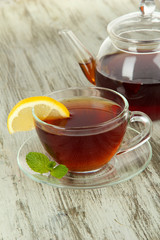 Cup of tea with lemon on table close-up