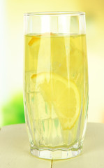 Delicious lemonade on table on light background