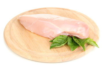 Raw chicken fillets on wooden board, isolated on white