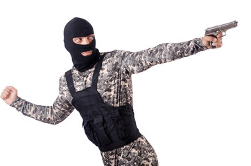 Soldier in camouflage with gun on white