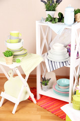 Beautiful white furniture with tableware and decor,