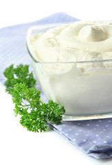 Sour cream in bowl close-up