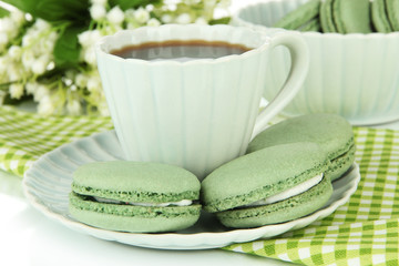 Coffee and macaroons close-up