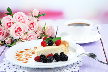 Slice of cheesecake with raspberry and blackberry