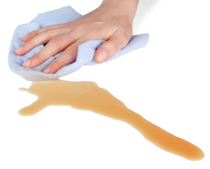 Hand wiping surface with blue rag isolated on white