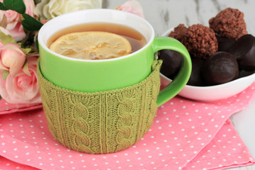 Cup with knitted thing on it close up