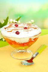 Tasty jelly in bowl on table on light background