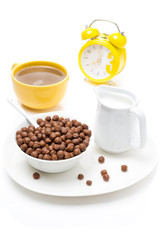 chocolate flakes, coffee with milk, jug of milk and alarm clock