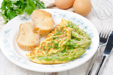 omelette with asparagus and green with toasts, horizontal