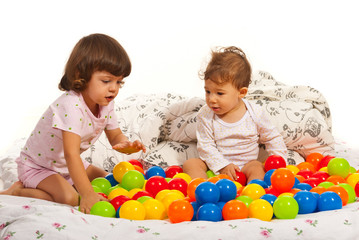 Fototapeta na wymiar Children playing with colorful balls