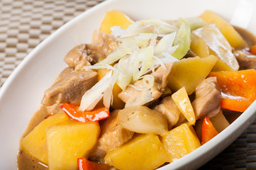 braised pork in curry sauce with potatoes, onions and carrots