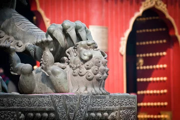 Deurstickers Bronze lion statue in front of Lama Temple in Beijing, China © Fotokon