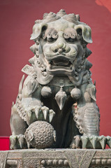 Bronze lion statue in front of Lama Temple in Beijing, China