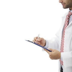 Young Doctor Filling Out Medical Document