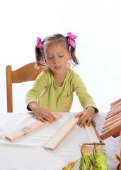 small girls in do handicraft