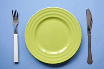 green plate on blue
