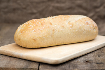Loaf of sourdough bread in rustic kitchend setting
