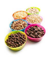 various kids cereals in plastic bowls