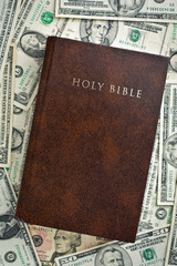 Naklejka premium holy bible on us dollars