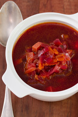 beet soup in bowl with spoon