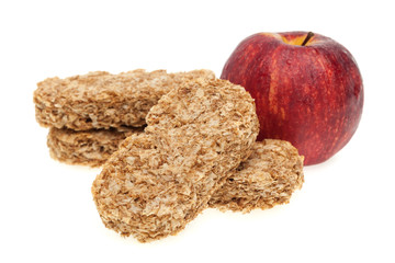 Muesli bar and red apple isolated