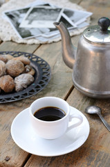 Coffee and dried figs on wooden surface