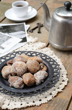 Dried figs, coffee pot, cup of coffee and vintage cards
